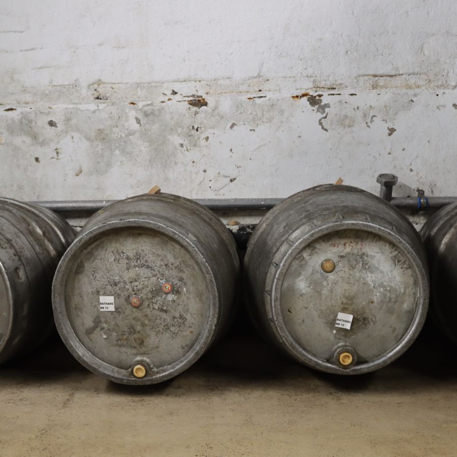 Photo of a row of Bathams steel beer barrels