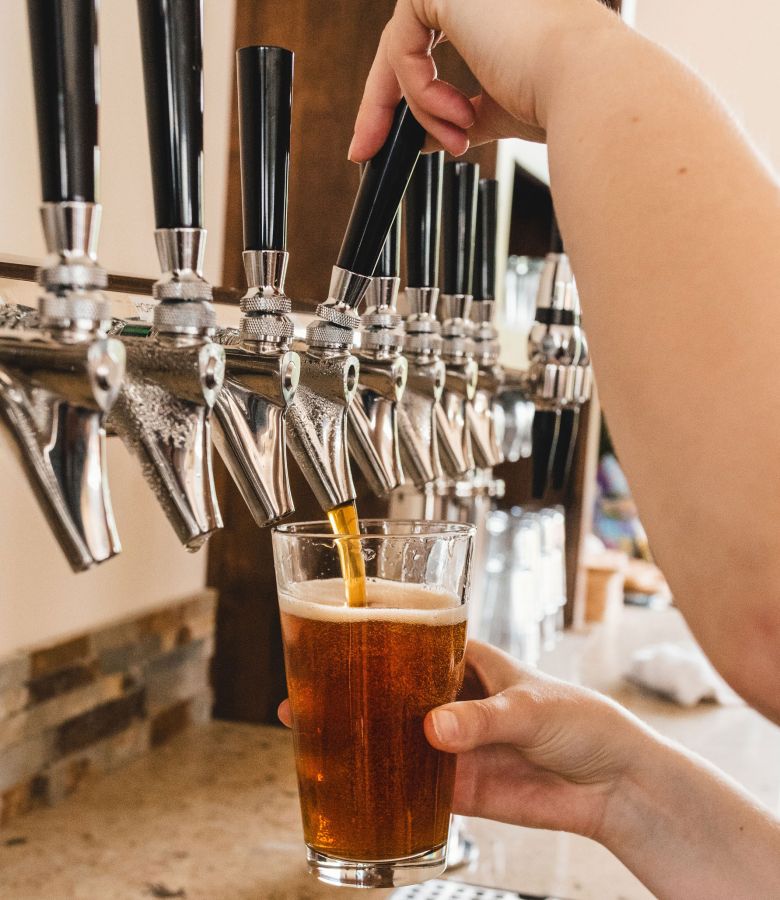 Photo of beer being poured from a beer tap into a pint glass©2020, Meritt Thomas Photography @ Unsplash