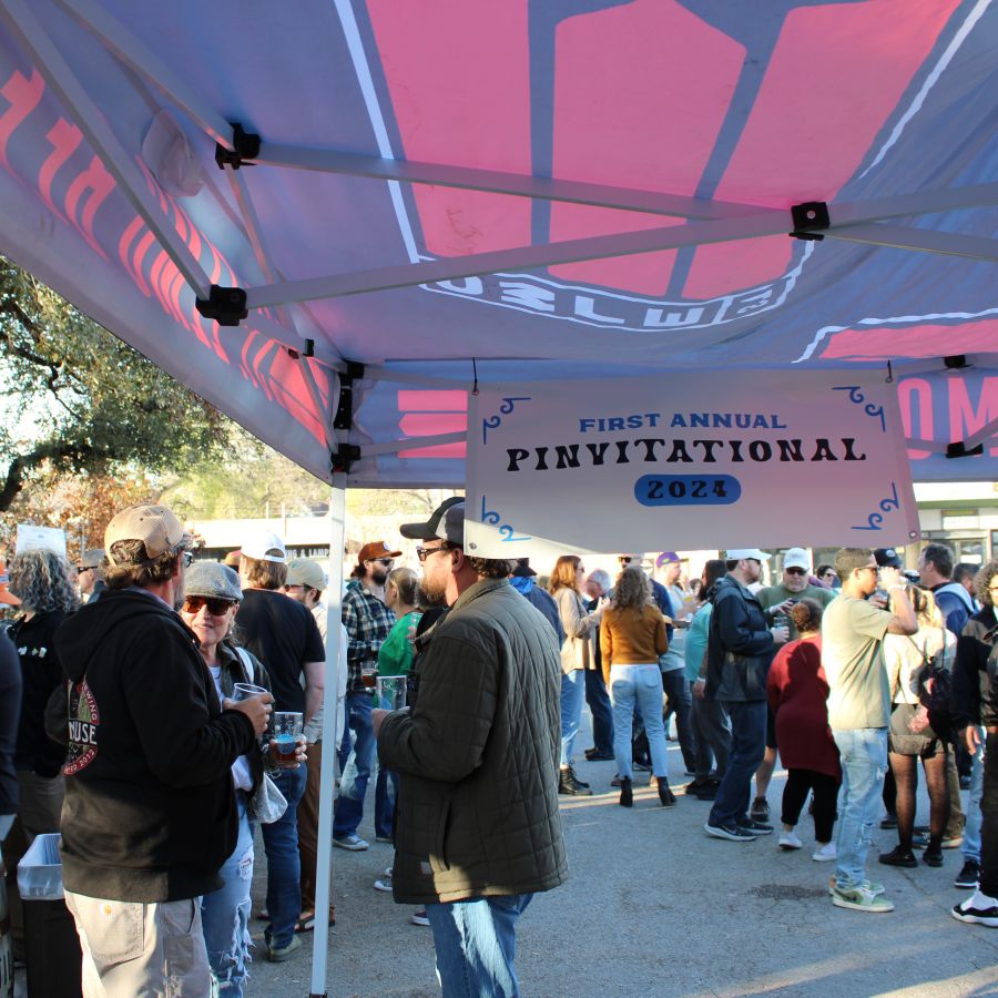 Photo of people hanging out at Pinvitational under a gazebo © 2024, Justin Brummer
