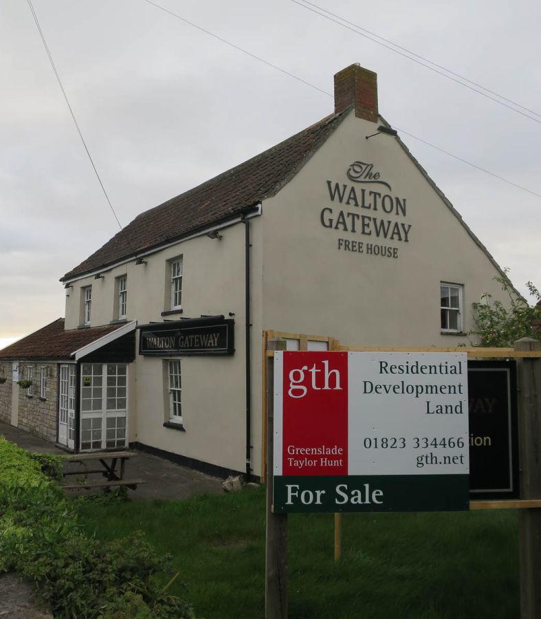 Photo of an exterior of the Walton Gateway pub, with a for sale sign in its garden © Hugh Venables 2017, Creative Commons License