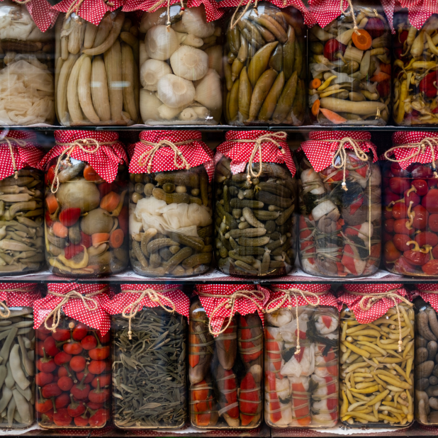 Three rows of jars of fermented vegetates © Mehmet uzut
