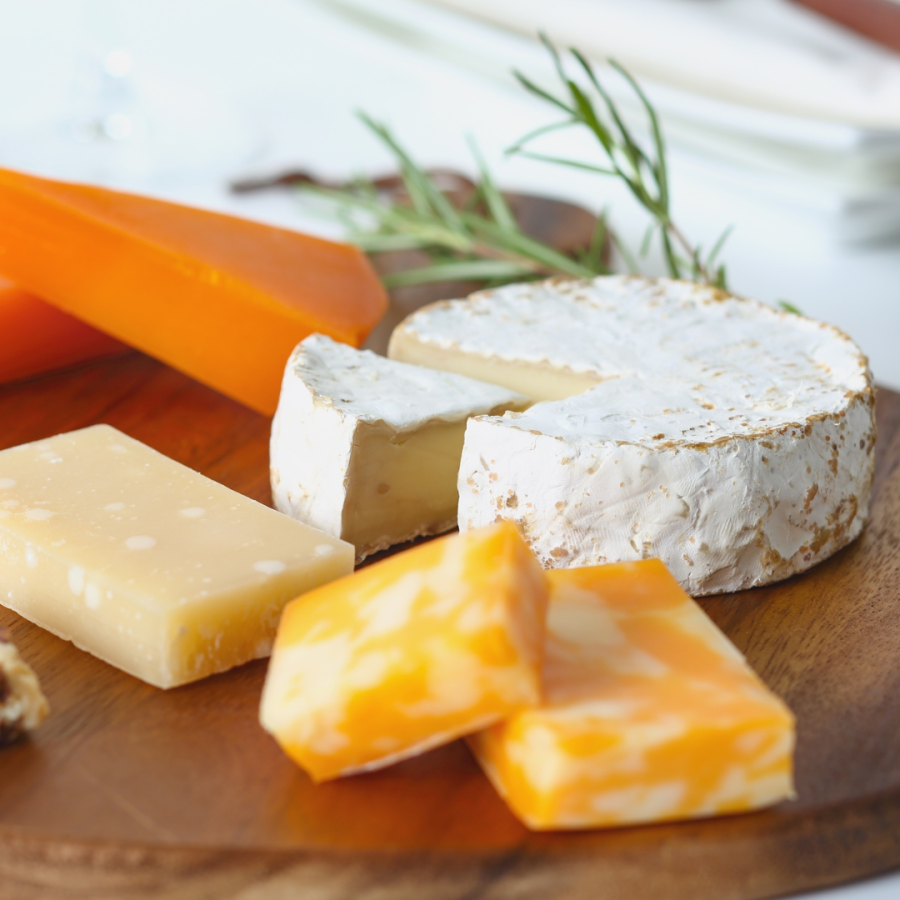 Wooden cheese board with various artisan cheeses © Aflo Images